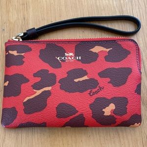 Coach wristlet wallet 6 1/4" (L) x 4" (H).  Holds 2 credit card slots
